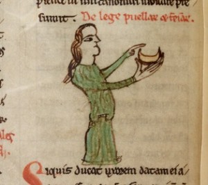A wife holding a dish in the Welsh Laws of Hywel Dda, Peniarth 28 MS, f.22v (Digital Mirror).